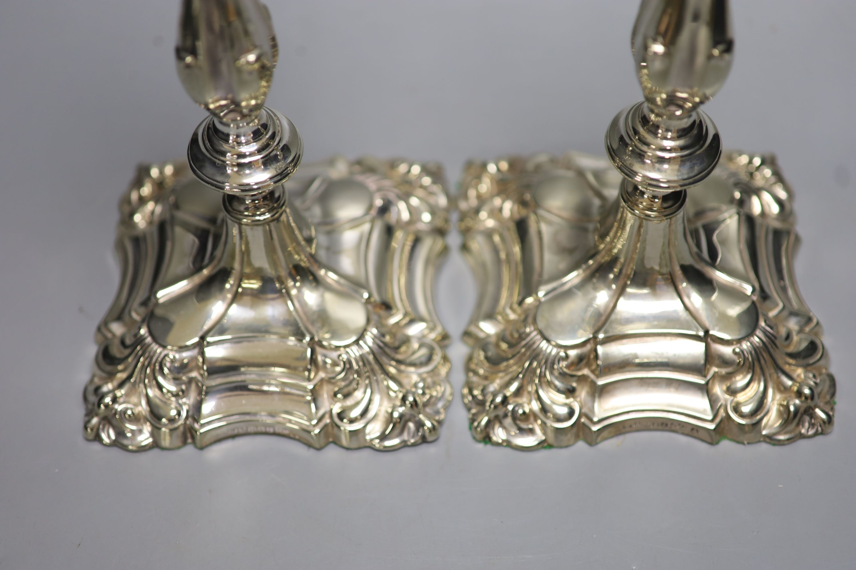 A pair of Walker & Hall silver plated candlesticks, height 29cm
